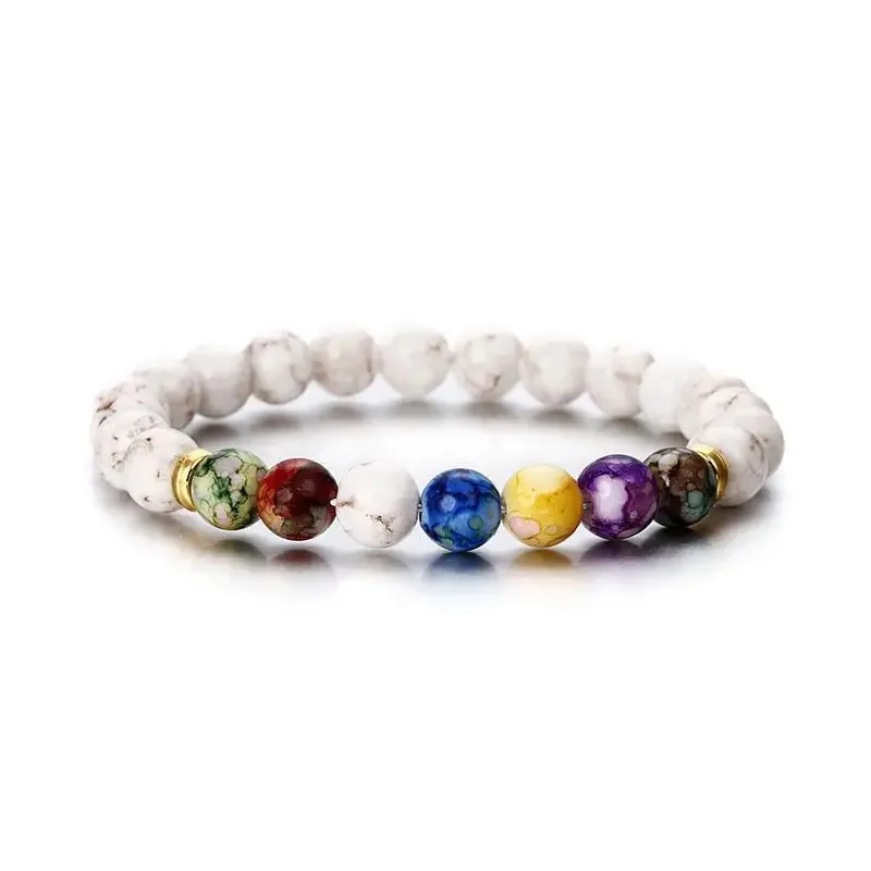 Chakra bracelet positioned beside natural stones for a calming aesthetic