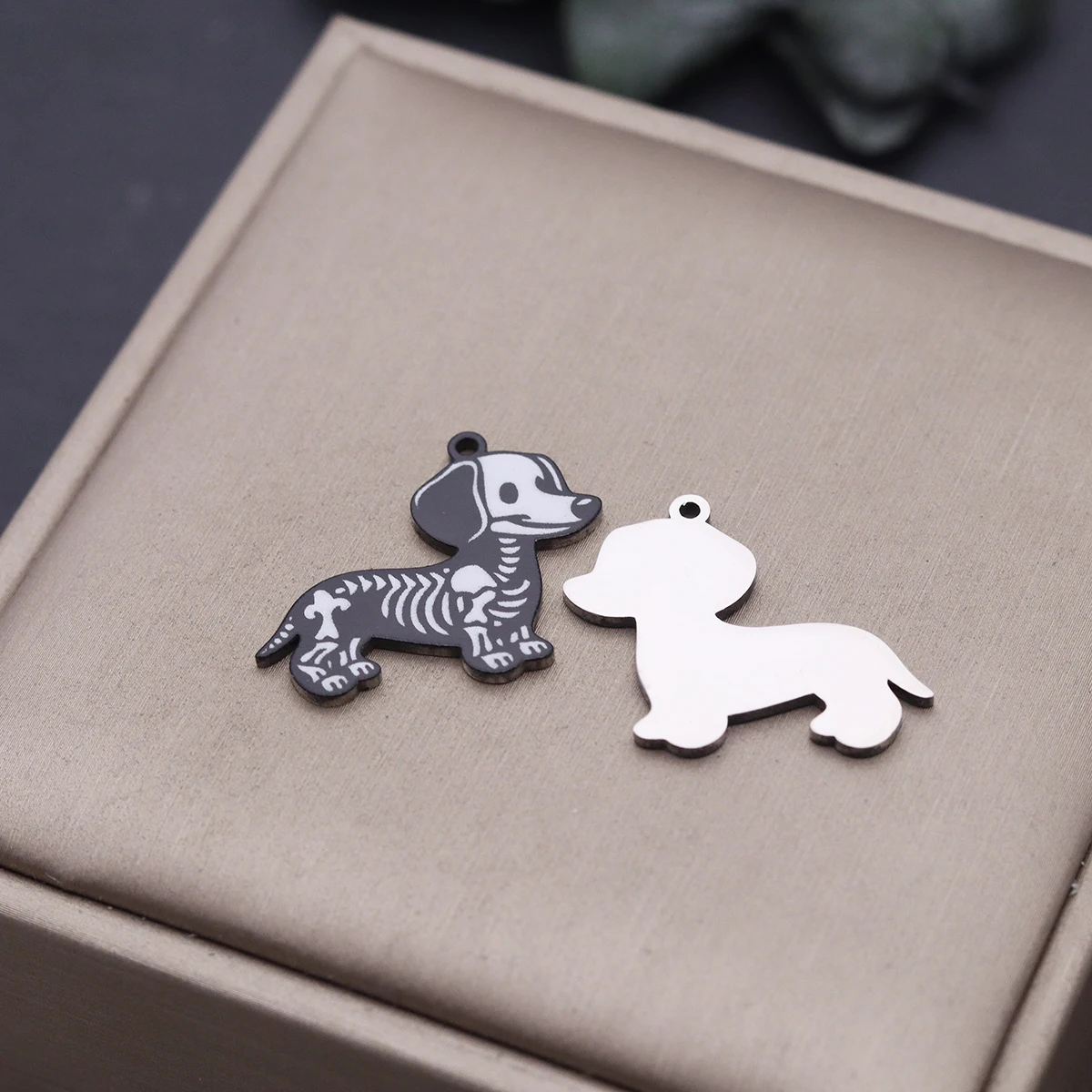 Flat stainless steel dachshund dog charms featuring a detailed cartoon skeleton pattern for Halloween jewelry crafts.