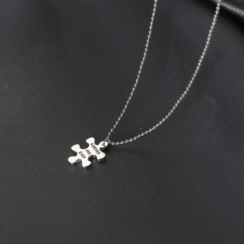 Matching Valentine necklace pair photographed with roses