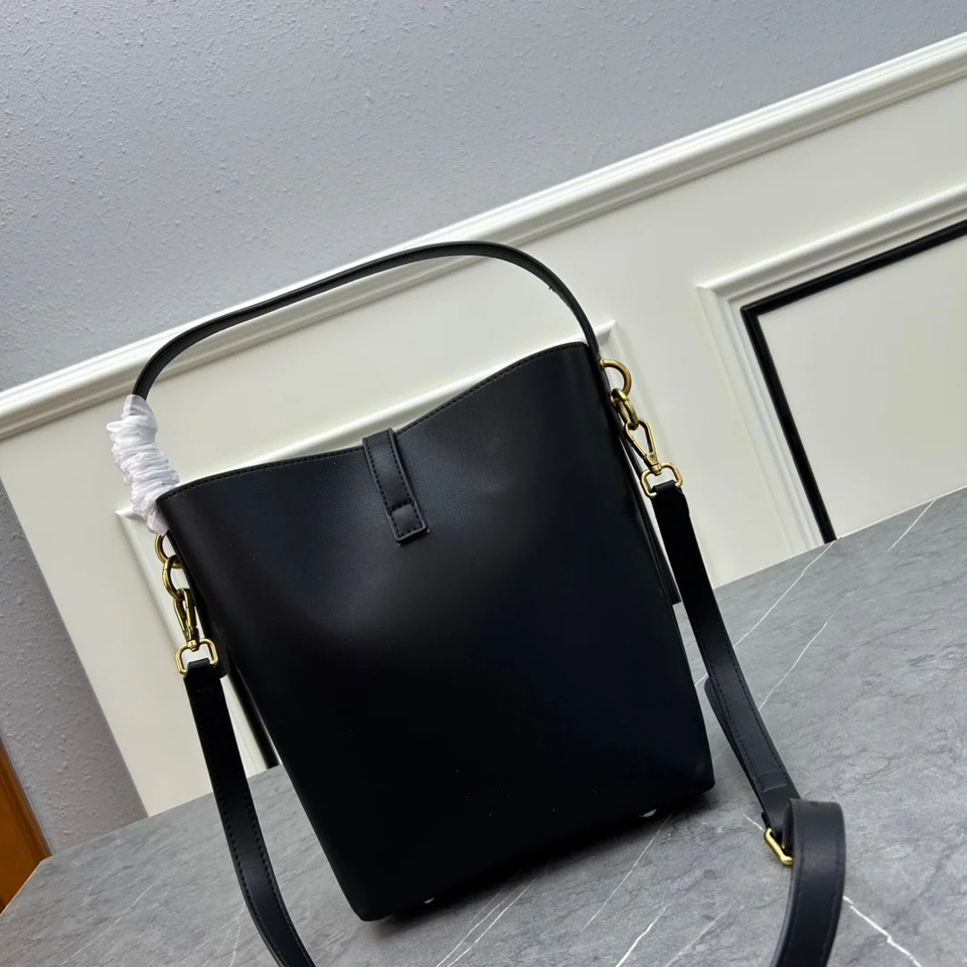 

Classic Elegant Female Luxury Shoulder Portable Slung Bucket Bag Cowhide Material With Metal Logo Design.