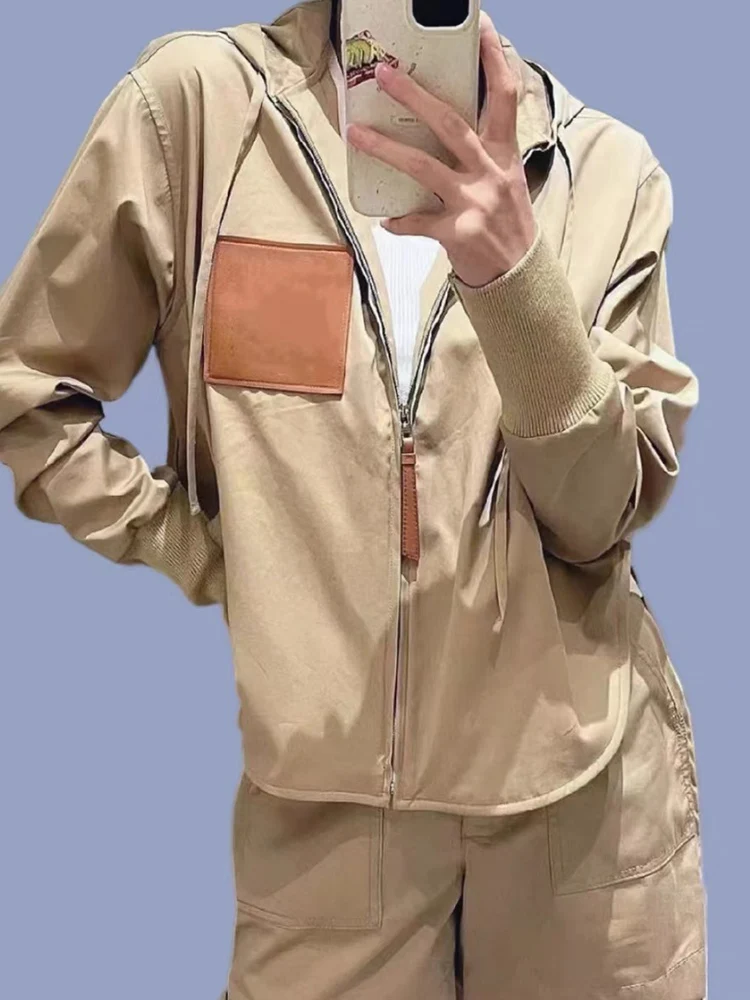 

Retro fashion women's coat spring and autumn new pocket stitching Joker casual loose single-breasted irregular windbreaker coat.
