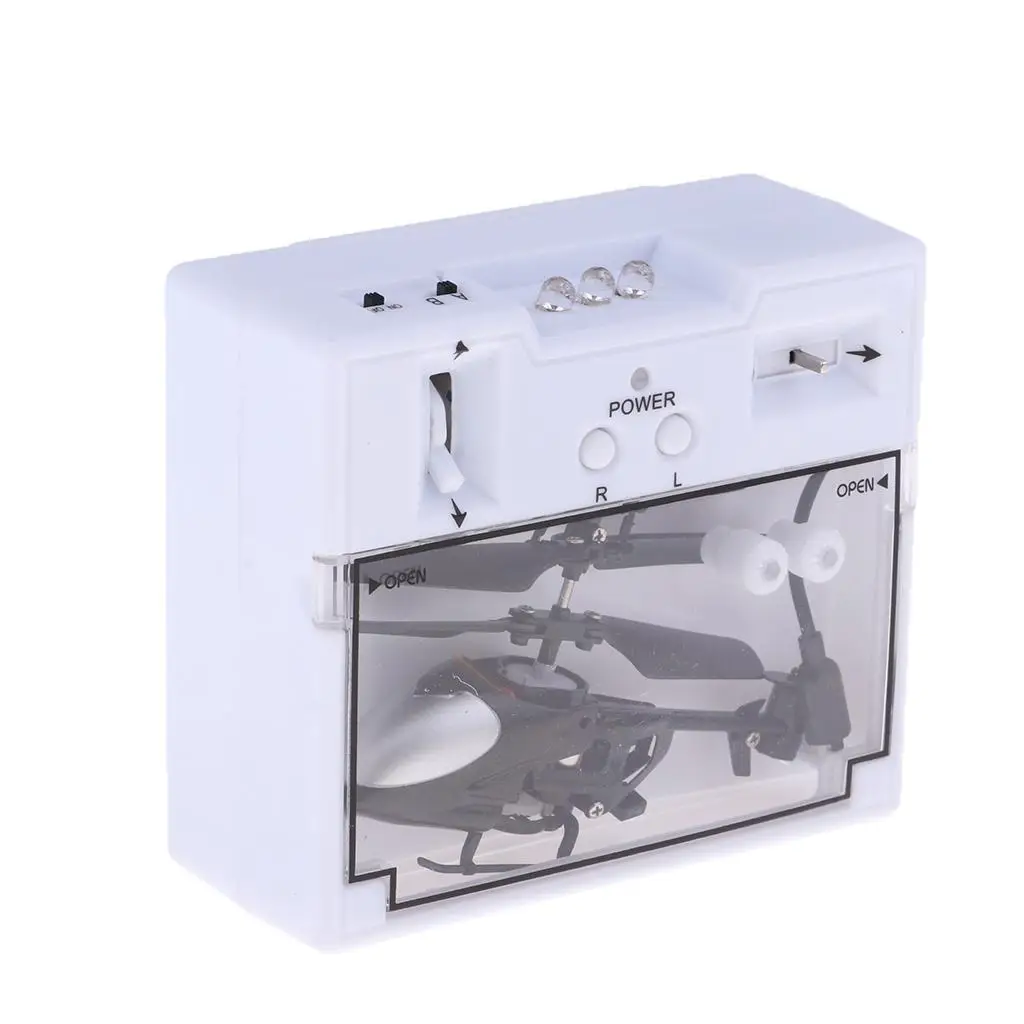 Mini hélicoptère RC vert posé sur une table, vue détaillée des pales et du châssis résistant aux chocs - Idéal pour enfants.