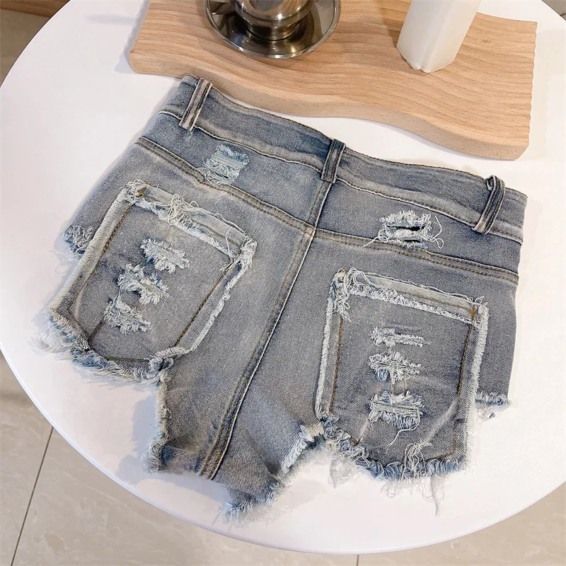 Sexy High Waist Hip Lift Ultra-Short Denim Shorts Women Tassel Splice Broken Holes Triangle Trousers Female Three Quarter Pants