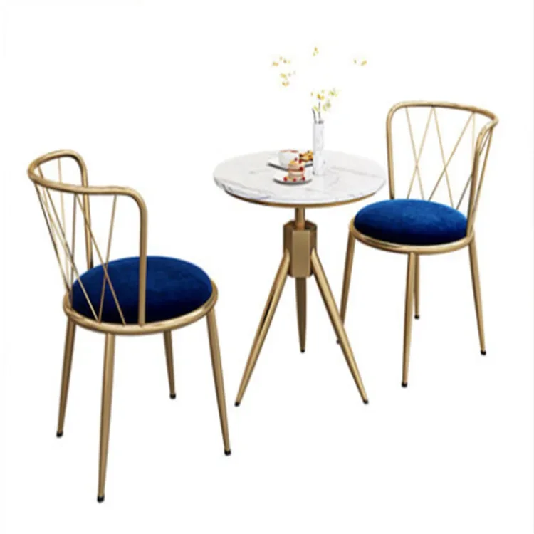 pink velvet fabric chair with gold legs and round table with marble top coffee shop furniture chairs and tables