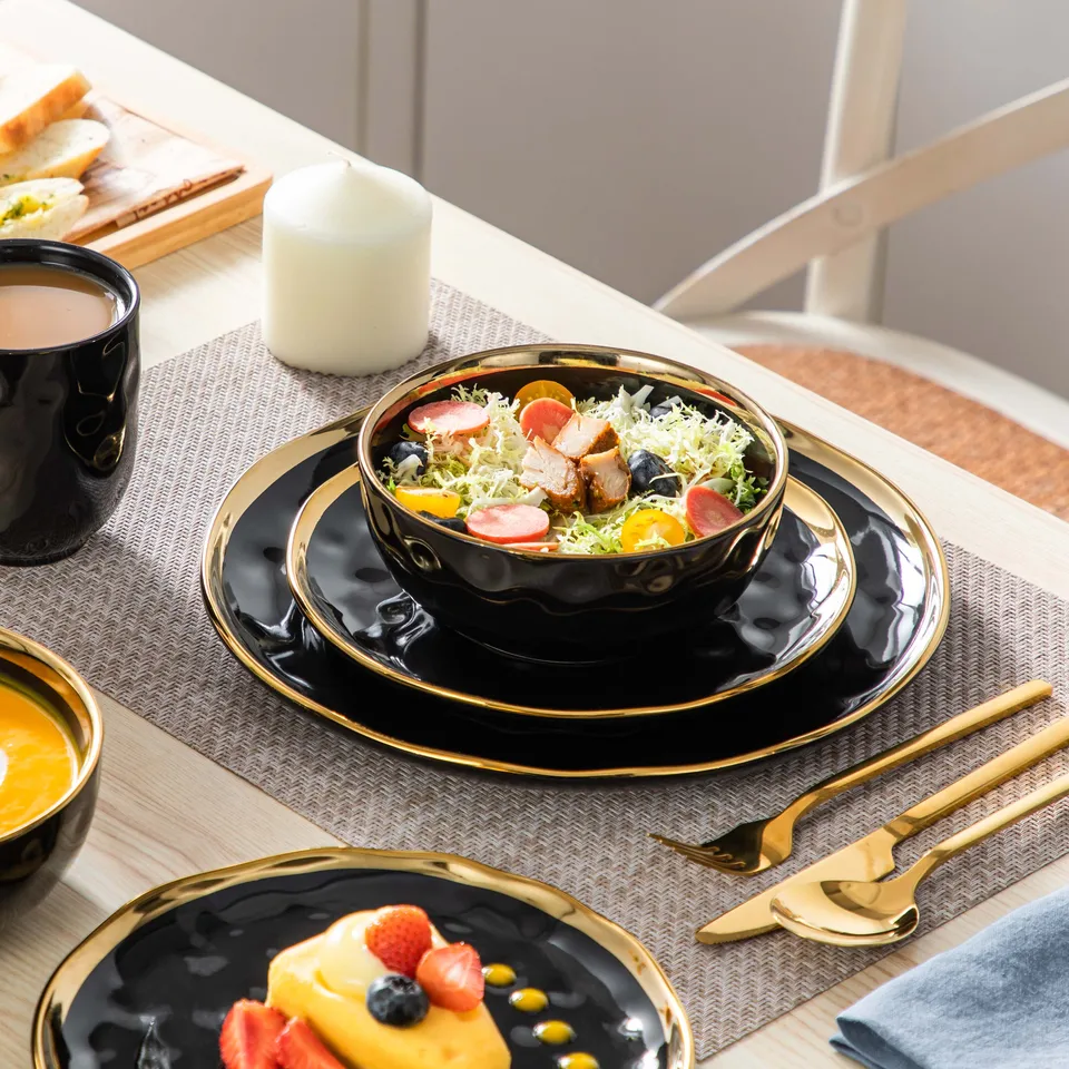Elegant Black Porcelain Dinnerware Set with Gold Trim