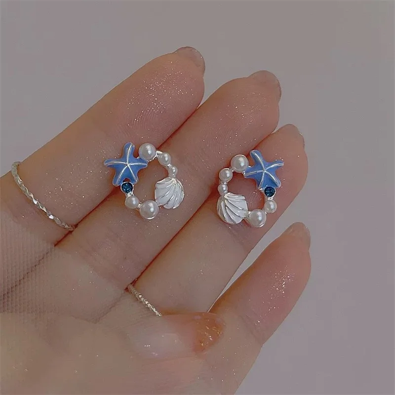 Boucles d'oreilles étoile avec perles océaniques main image 1