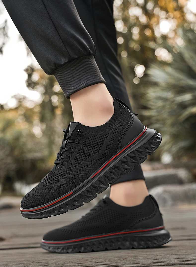 Pair of brown mesh sneakers with soft soles placed on a concrete surface, highlighting breathable texture and sporty silhouette black
