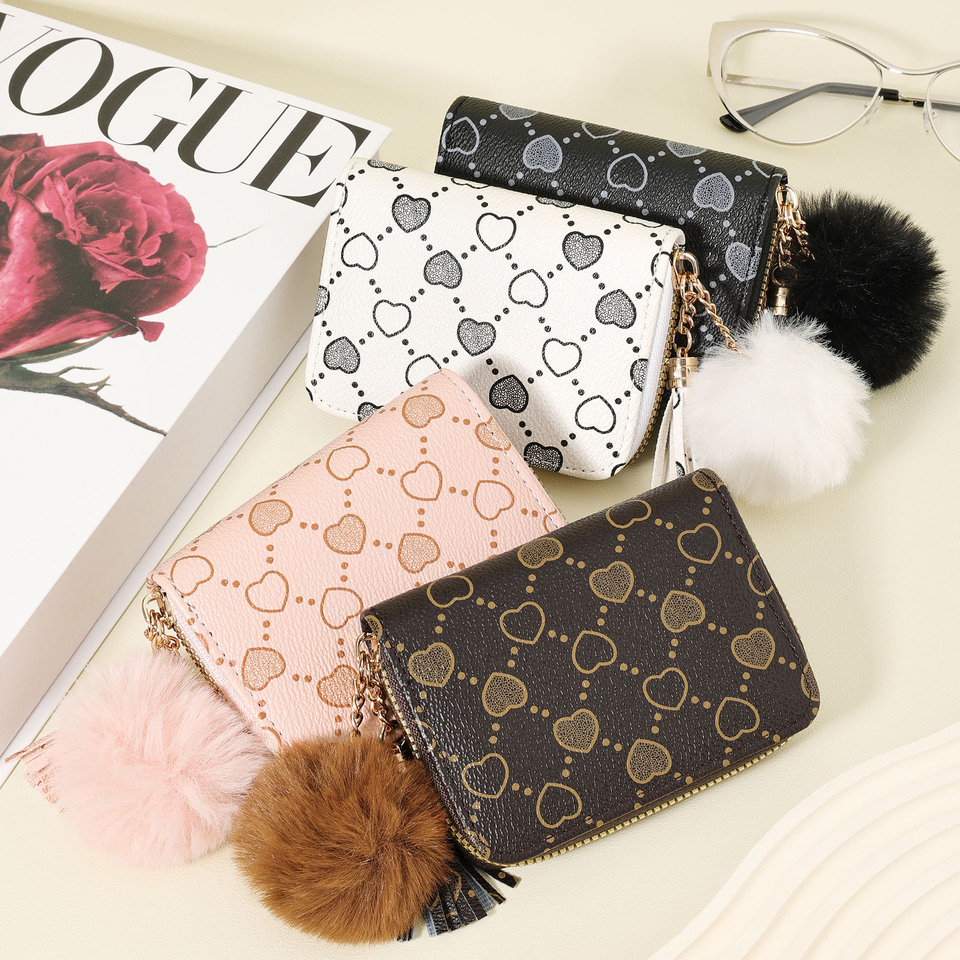 New women's wallet, featuring a simple and casual style Pom pom Accent with multiple card slots, a zipper around the wallet, a s