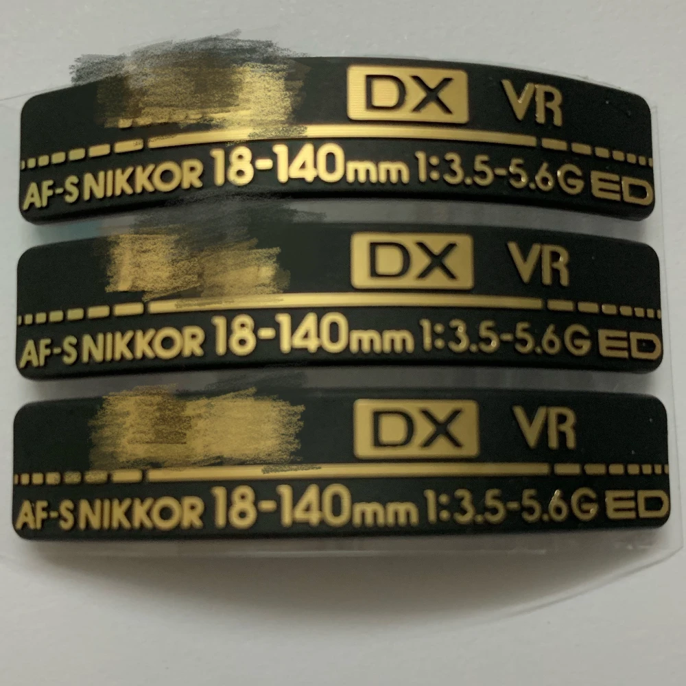 

1PCS Brand-new for Nikon AF-S Nikkor 18-140mm 1:3.5-6.3 G ED Lens LOGO Nameplate Camera Repair Accessories
