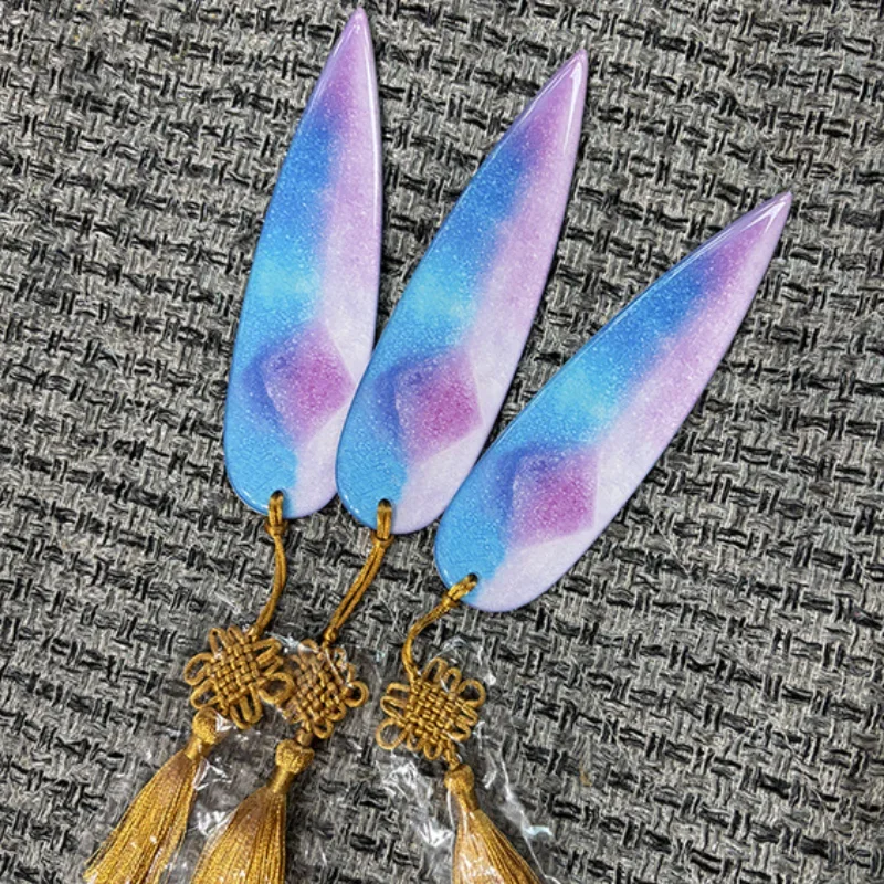 Hand holding colorful resin dart prop