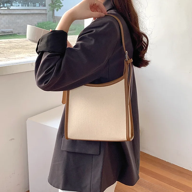 

2024 New Women's Bag Korean Designer Middle Handbags Shoulder Bag Canvas PU Leather Patchwork Ladies Oxter Bag Whole Sale