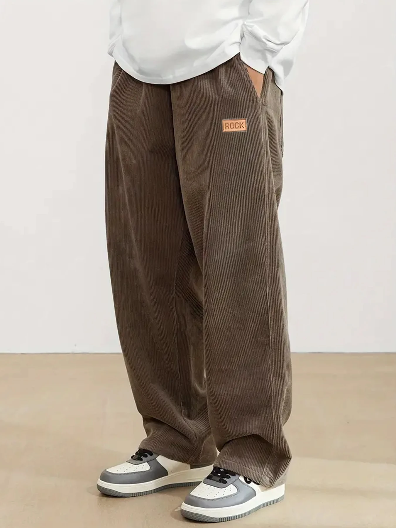 Autumn and winter men's corduroy casual pants with leather label decoration solid color pockets straight leg pants men trousers
