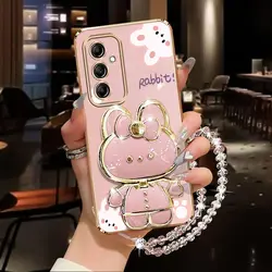 Elegant Diamond Wrist Strap Phone Holder Case with Rabbit Design and Stand Functionality - Samsung A34 5G (Pink)