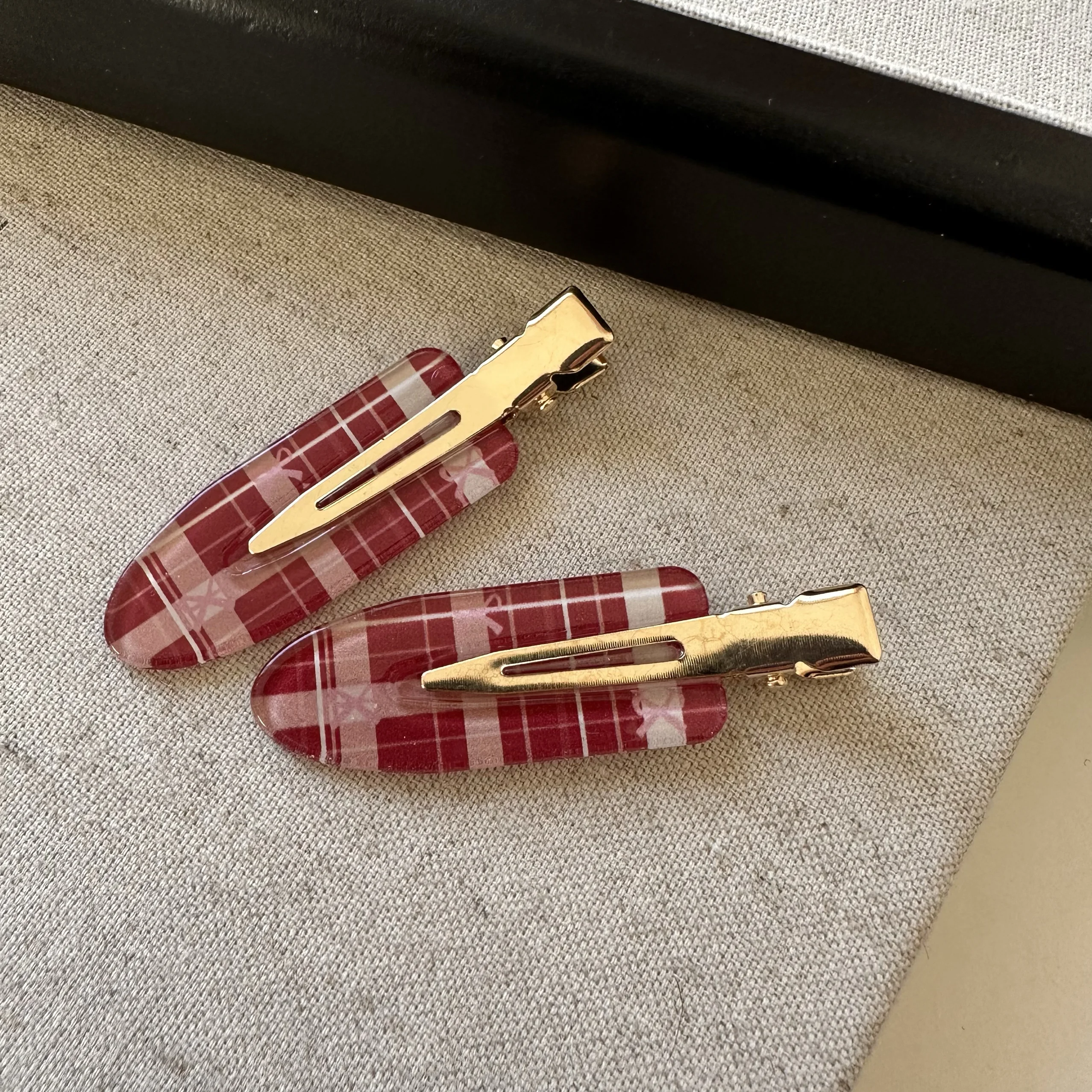 A pair of white and red large plaid