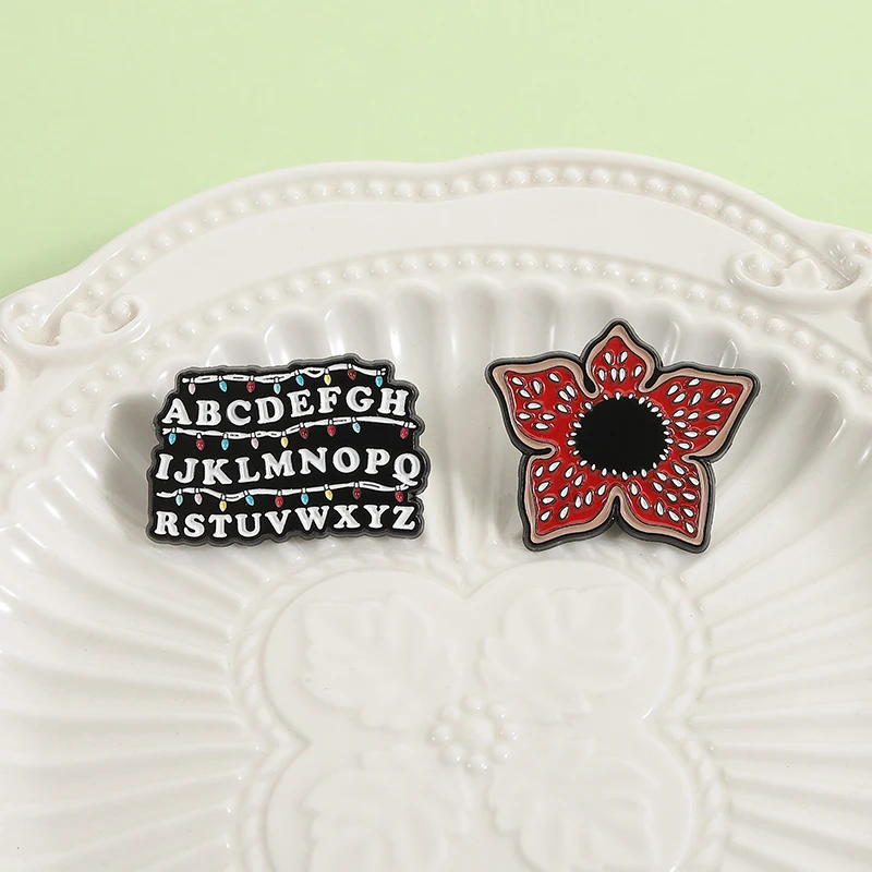 Sci-fi Horror Movies Brooch Enamel Pins Red Cannibal Flowers And 26 English Letter Brooches Backpack Lapel Badge Jewelry Gifts Image 5