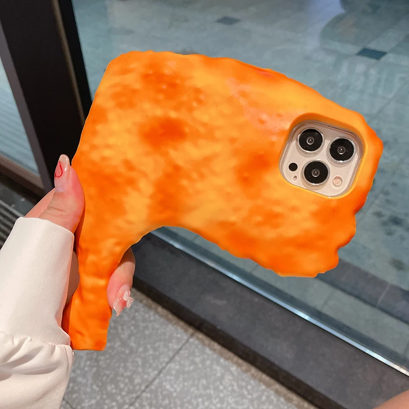 A hand holds an iPhone with the Chicken Drumstick iPhone Case, designed to look like a large, orange fried chicken drumstick.