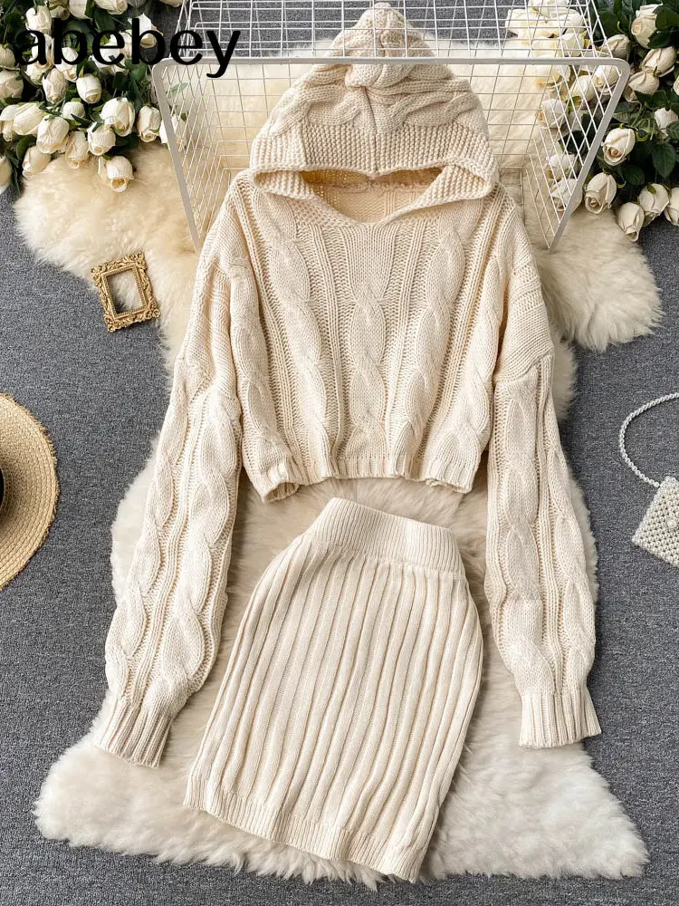 

Модный плотный вязаный комплект для женщин, короткий свитер с длинным рукавом и капюшоном + Соблазнительная облегающая юбка, новый осенне-зимний костюм из двух предметов