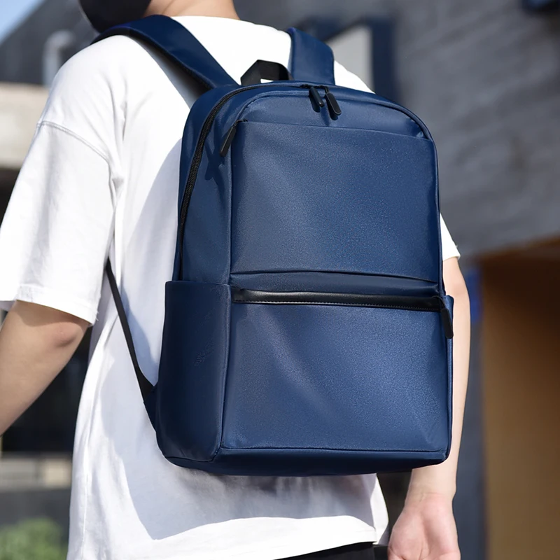 Men's large capacity laptop backpack with adjustable shoulder straps, durable for travel and school