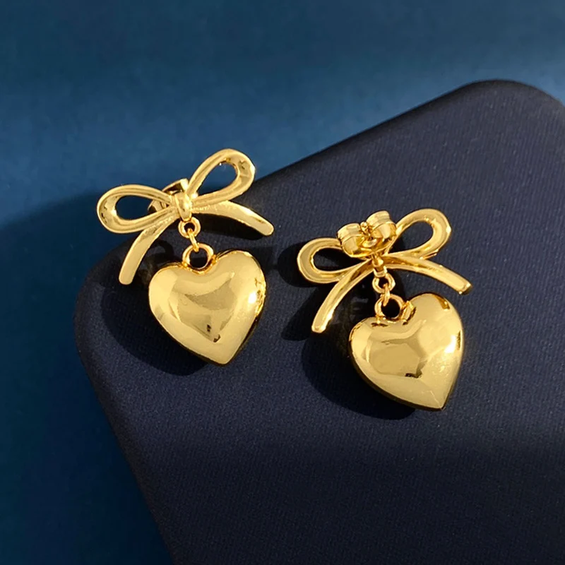 

New metal glossy bow love three-dimensional peach heart stud earrings