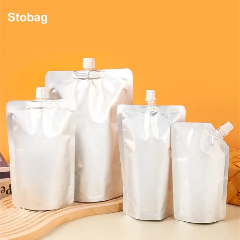 

StoBag 100pcs Wholesale Aluminum Foil Liquid Bags Nozzle Drinking Packaging Milk Juice Beverage Sealed Storage Reusable Pouches