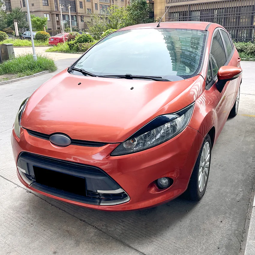 2008 To 2012 For Ford Fiesta MK6 ABS Gloss Black Carbon Fiber Look Front Headlight Eyebrow Eyelids headlight lamp cover headlight eyebrows eyelid Light Stickers car sticker Lamp Cover