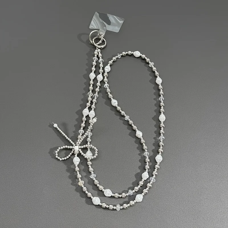 Kreatywna nowa smycz do telefonu komórkowego, perłowa kokarda, sznurek z koralików, akcesoria do bagażu do noszenia na skos, etui na telefon, łańcuszek-pendant.