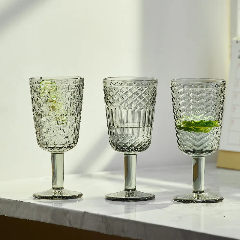 https://ae01.alicdn.com/kf/S9d17f6616349427fbc39e6d6056b6ee9H/1-Piece-Vintage-Embossed-Clear-Colored-Goblet-Green-Grey-Red-White-Wine-Glasses-Goblets-Stemware-Glass.jpg
