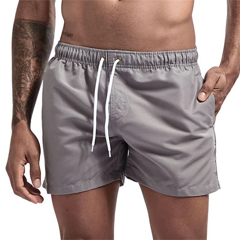 Costume da bagno da uomo con fodera in rete Tasche laterali Pantaloncini da spiaggia solidi Pantaloncini da surf leggeri con coulisse ad asciugatura rapida Costumi da bagno estivi