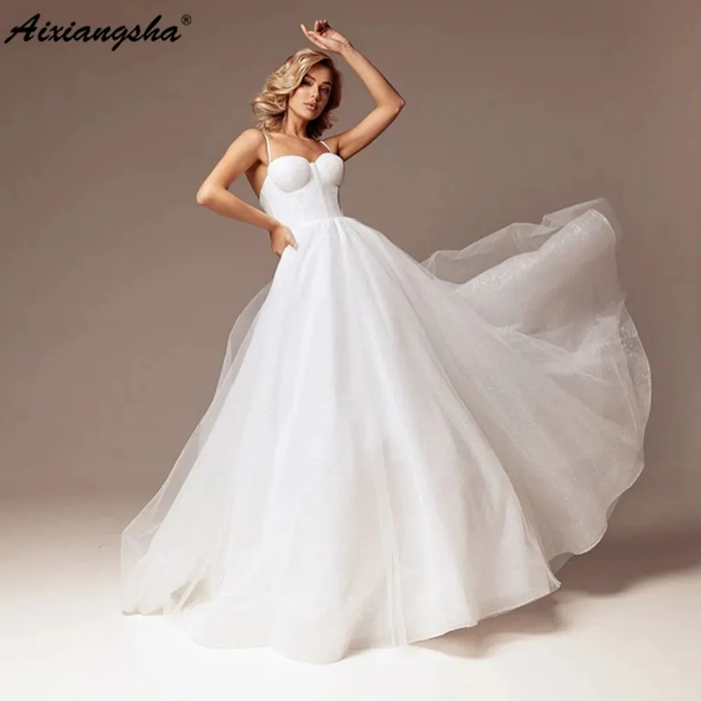 

Aixiangsha Sparkly Prom Dress Wedding Ball Gown Dress Ivory Bustier Corset Backless Wedding Dress with Pockets Spaghetti Strap