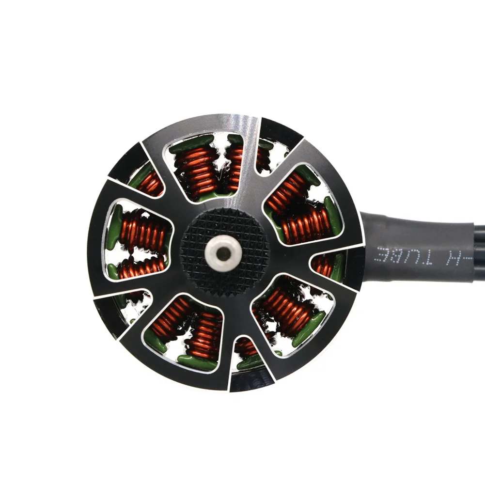 Moteur sans balais X4115 650KV 400KV posé sur une surface, avec câbles et connecteurs visibles.