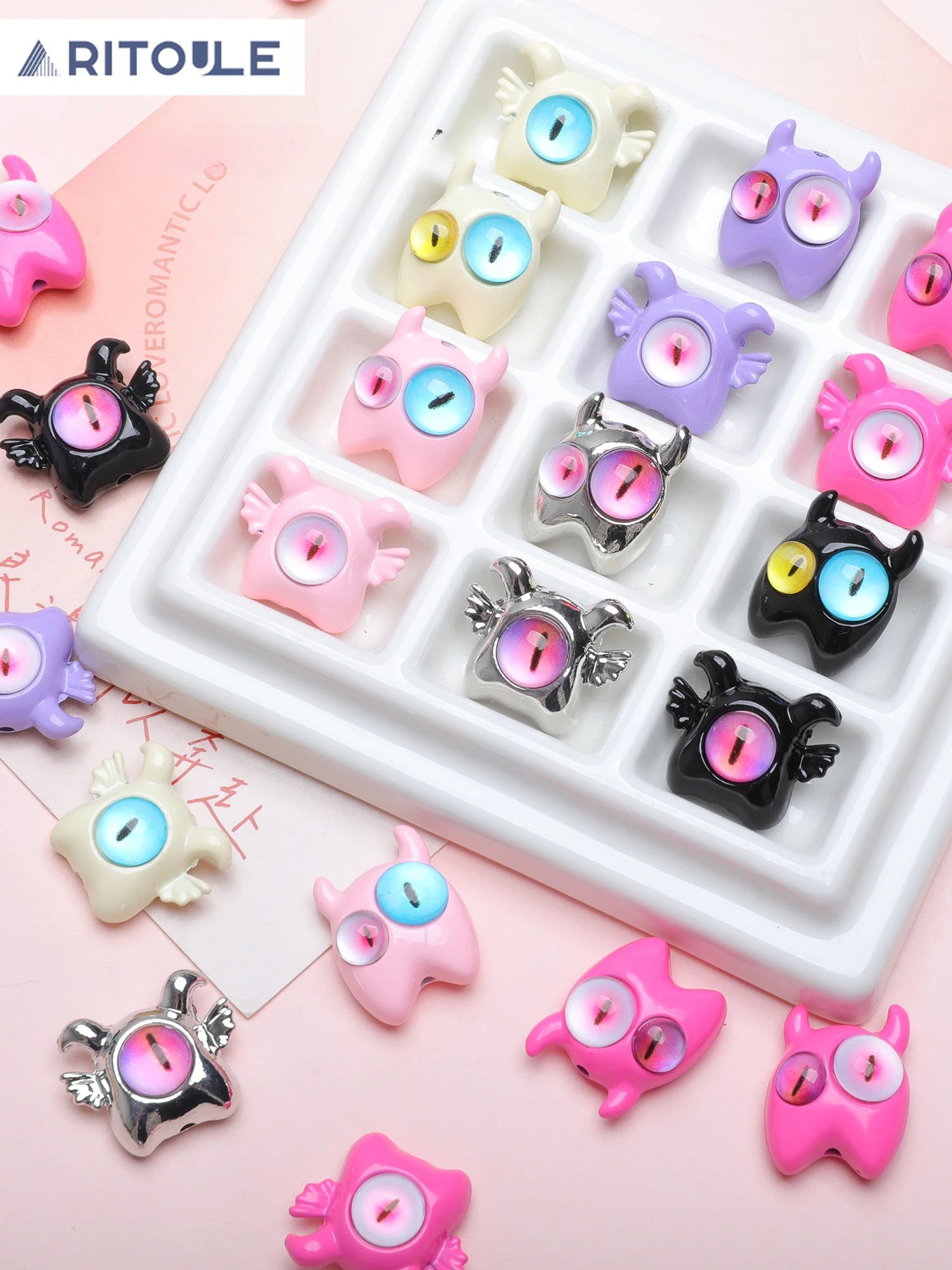

Color dopamine one-eyed monster alloy beaded diy handmade ear jewelry mobile phone chain necklace accessories materials.