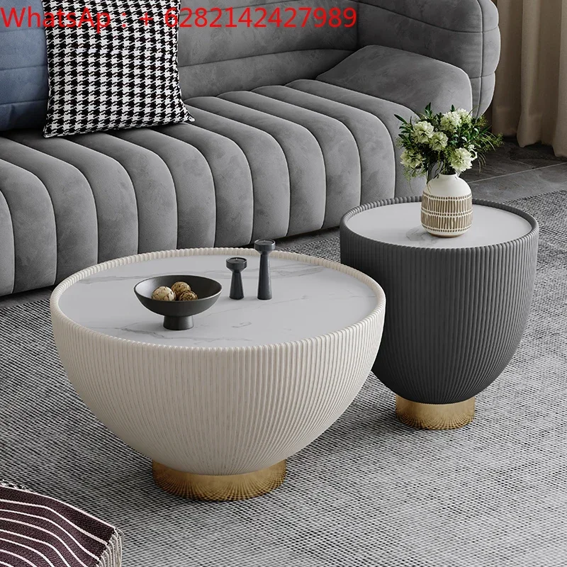 

Light extravagant high-grade round coffee table designer creative simple living room rock slab high and low coffee table