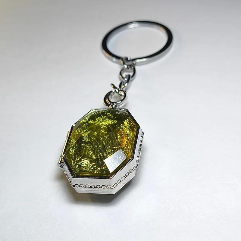 Sparkle Gem Keychain: Multi-Faceted Green/Yellow Crystal with Metal Rim and Unique Anti-Loss Design