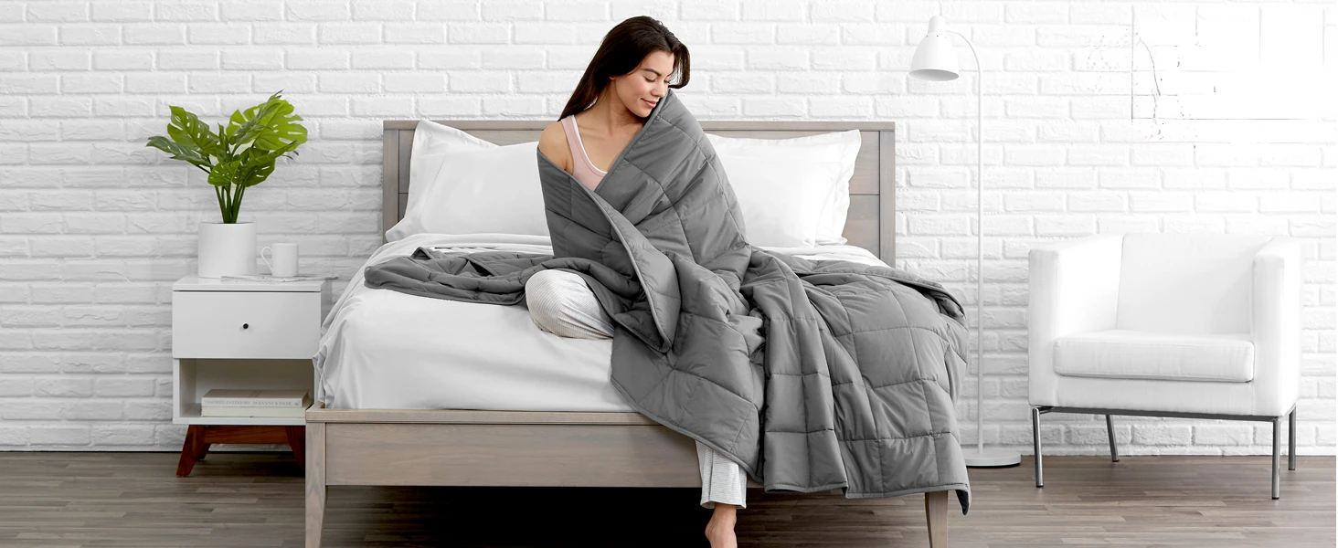 Women with weighted blanket wrapped around her