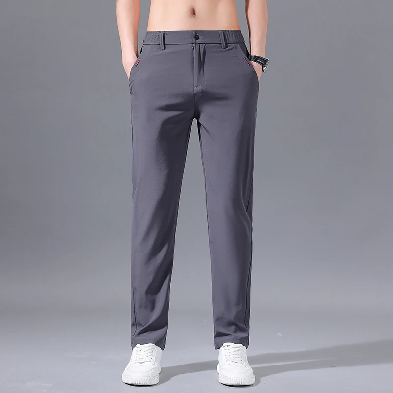 Spring Summer New Solid Color Fashion Elastic Waist Pants Man High Street Casual Button Pockets Patchwork All-match Trousers