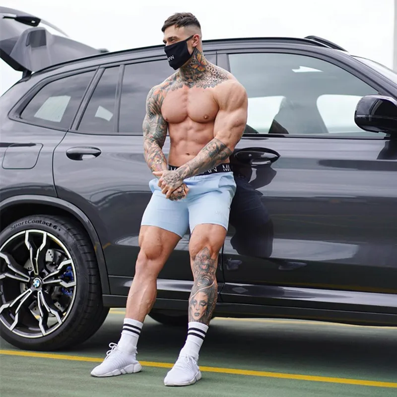 

Men Fitness Bodybuilding Shorts Gyms Workout Male Breathable Quick Dry Sportswear Jogger New Beach Sport Shorts Men's sweatpants