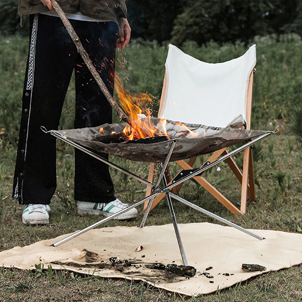 https://ae01.alicdn.com/kf/S9f45faf555ac41e4bc7dcb6180f61332E/Portable-Wood-Stove-Fire-Pit-Grill-Stand-Outdoor-Campfire-Stand-Stainless-Steel-Foldable-Fireproof-Stand-Wood.jpg