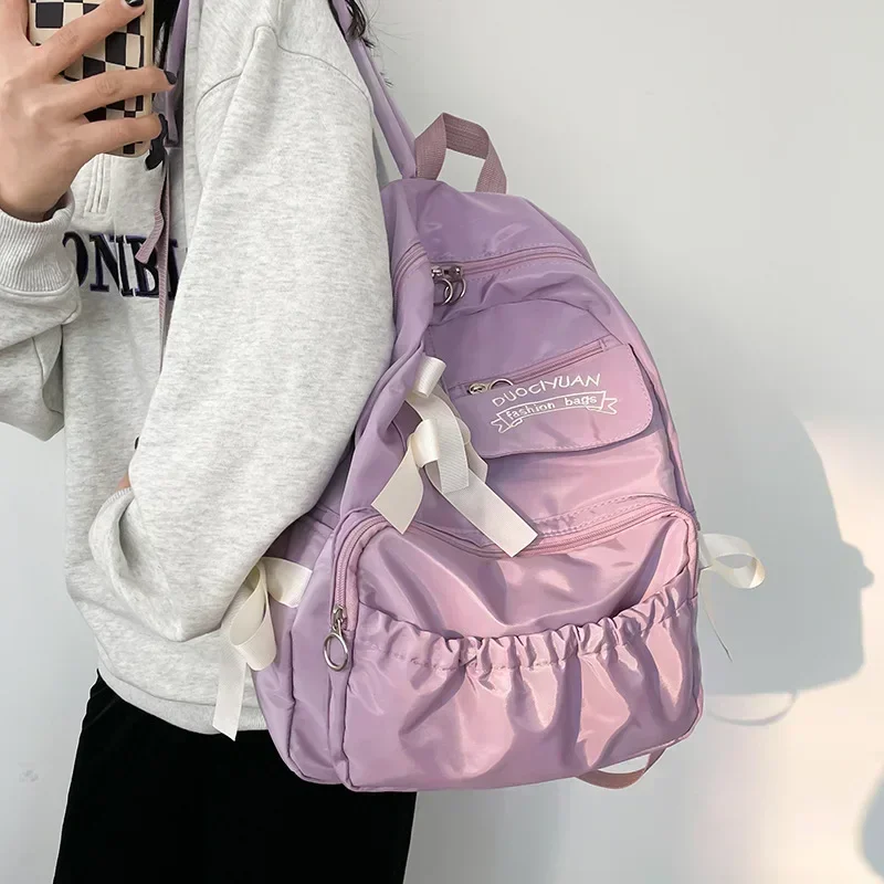 Modern fabric backpack for women, anti-theft shoulder bag, new school bag for girls, school backpack for females.