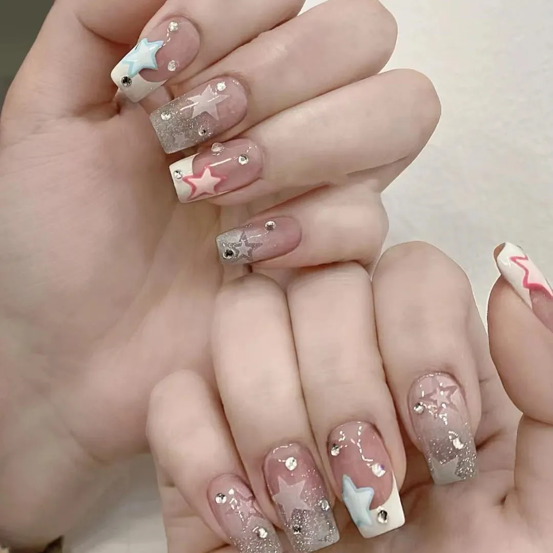 Acrylic nail extension, manicure, nail correction, hands in the foreground.  Reflective design. Stock Photo by Klimatis019019