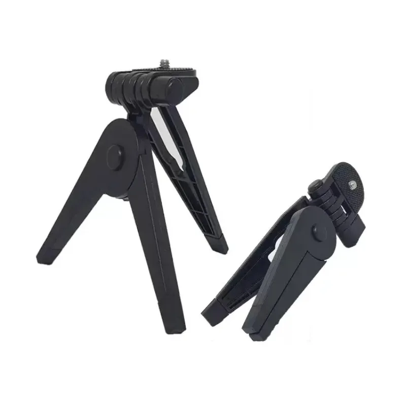 Vue rapprochée des pieds du trépied pliable portable universel pour appareil photo Canon Nikon Sony DSLR, montrant les loquets de verrouillage.