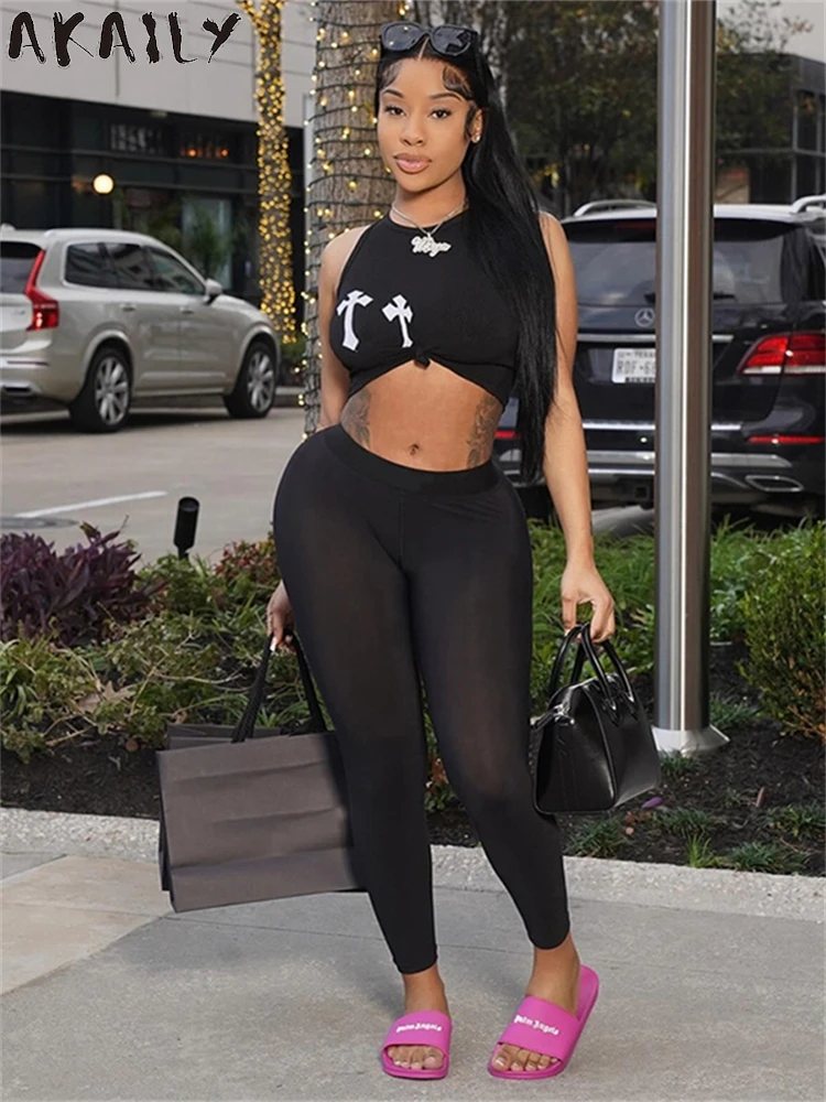 

Akaily Весенний костюм из двух предметов с черным принтом уличная одежда для женщин 2024 короткий топ без рукавов с графическим принтом и подходящие облегающие брюки