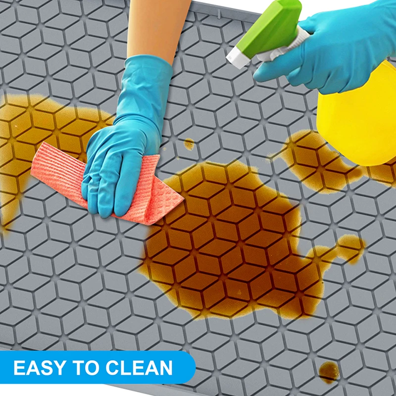 This Under-Sink Mat on  Makes Cleaning Under the Sink Easy