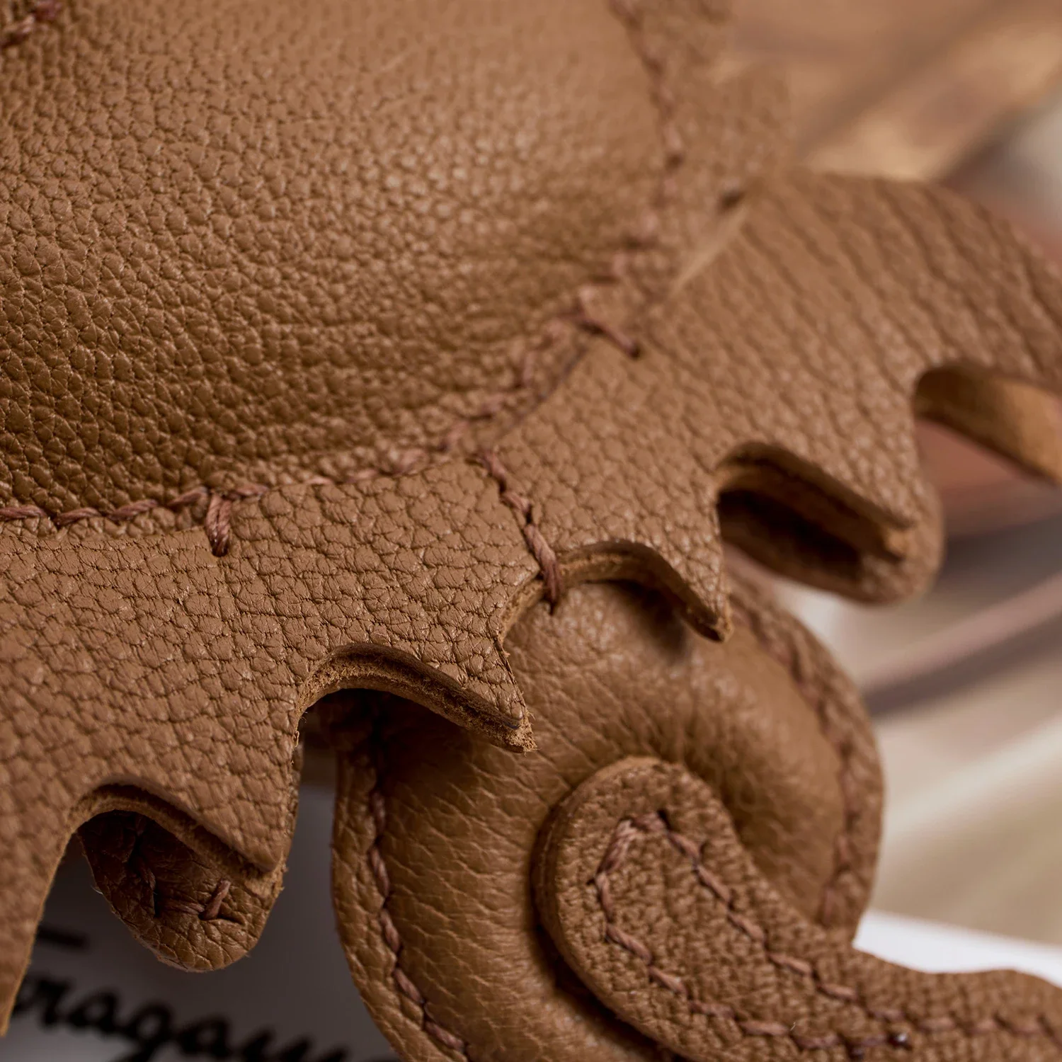 Leather dragon bag charm close-up