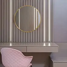 Round mirror in vanity