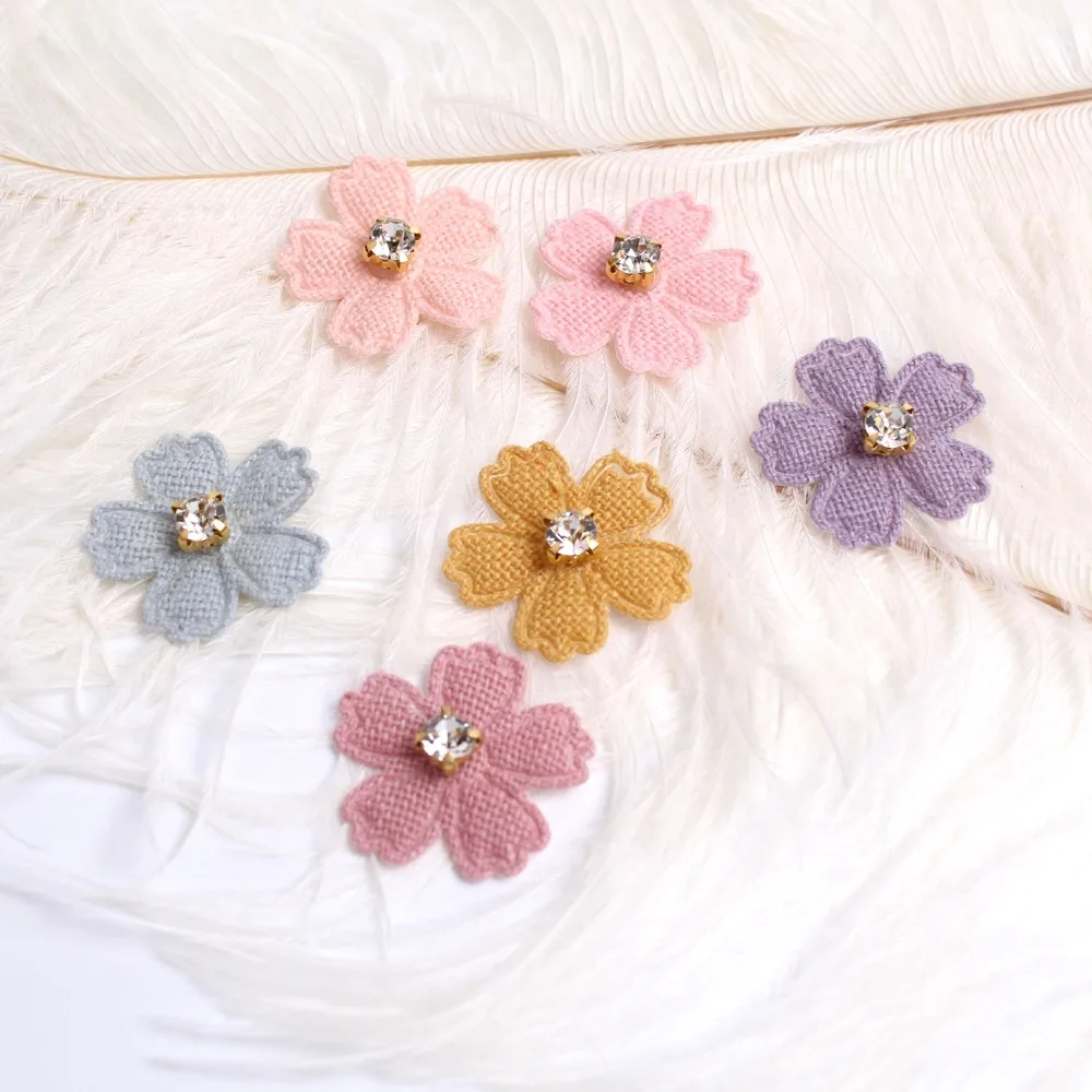 A set of 20 small fabric flower patches, perfect for use in projects, hair accessories, headbands, bows, and hat dec