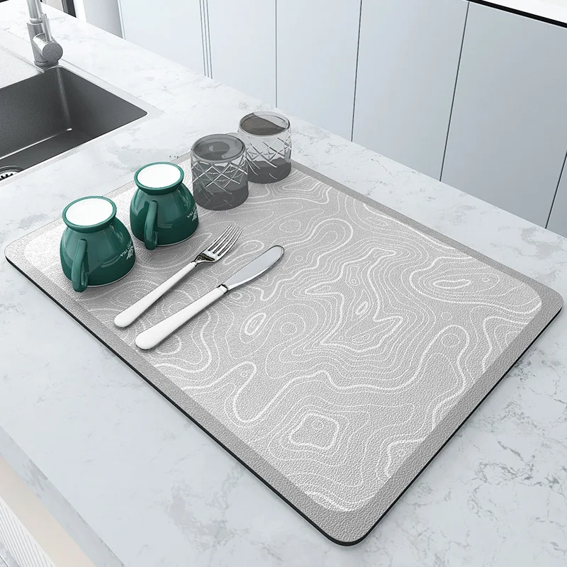 https://ae01.alicdn.com/kf/Sa03a95d578b74447a33e6459e6419680L/Kitchen-Dish-Drying-Mat-Diatomite-Quick-Drying-Counter-Top-Mat-Sink-Faucet-Non-Slip-Splash-Mats.jpg