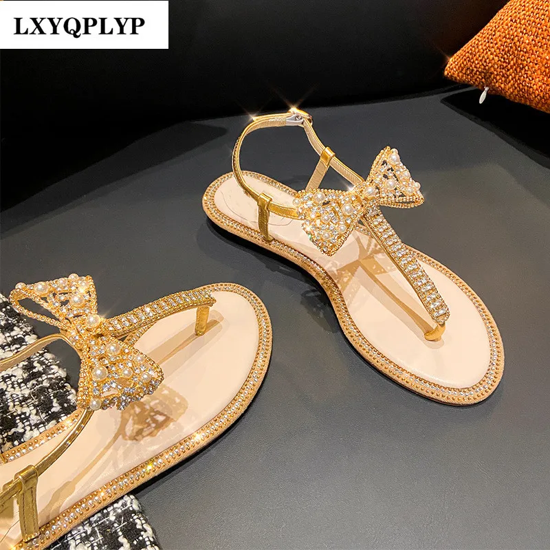 

Low-heeled Flat-heeled Rhinestone Pearl Bow Fairy Style Nightclub Street Fashion European and American Trend Roman Sandals