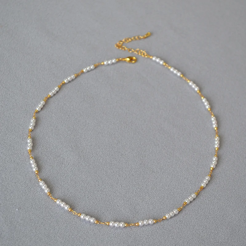 

Korean version niche fashion OL simple imitation pearl chain splicing brass plated commuting short necklace collarbone