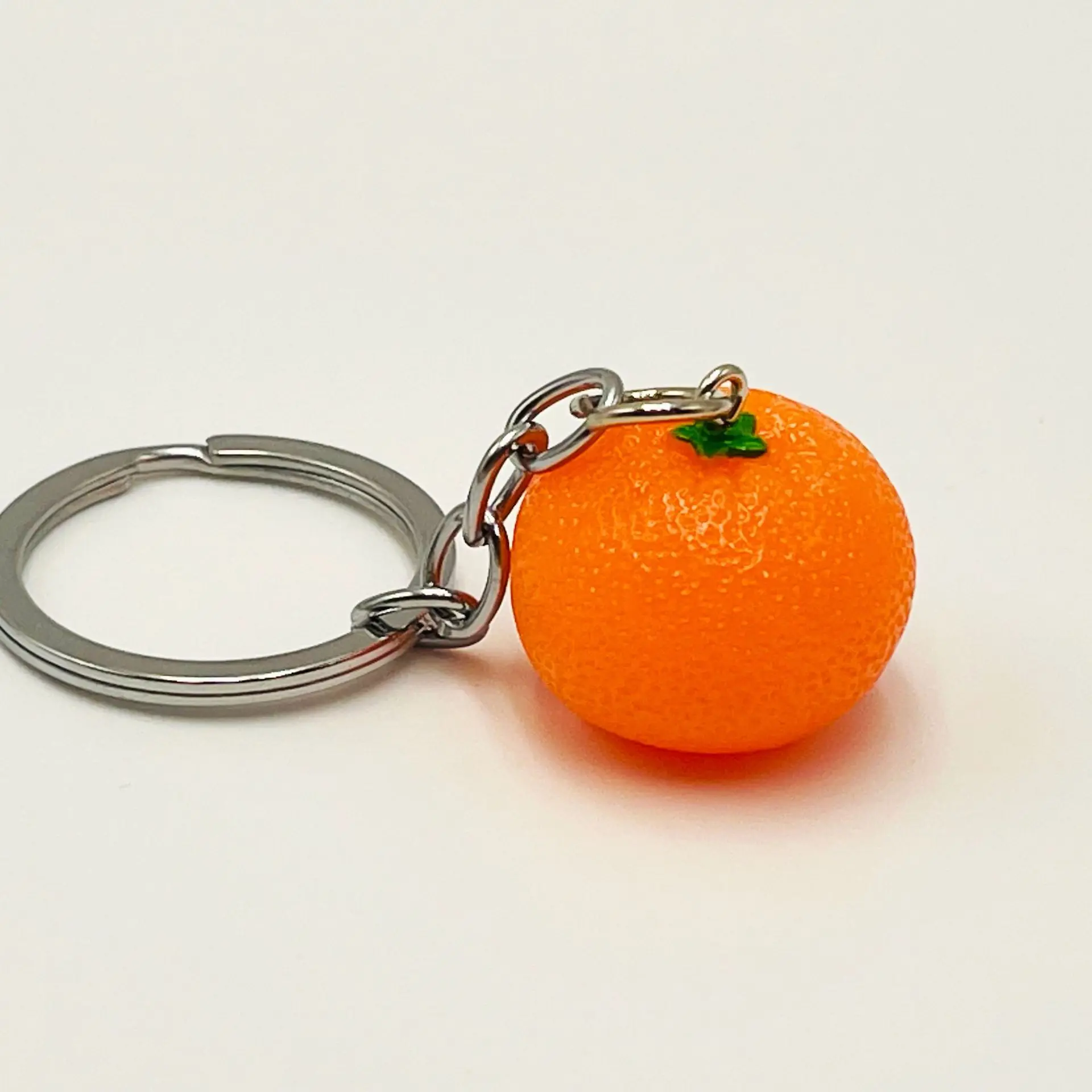 Porte clés transformable en pendentif ange orange de fête des