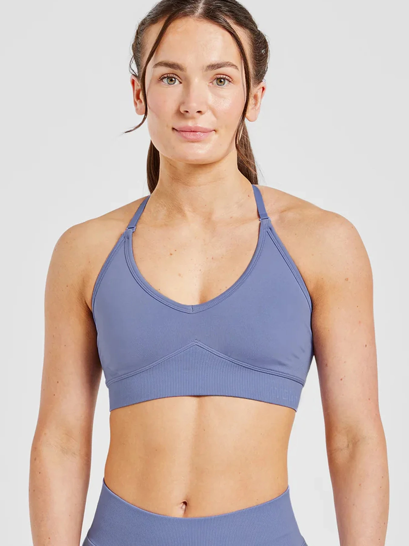 A one-piece impact bra with detachable shoulder straps, offering multiple combinations, and a sports bra that can bear a logo